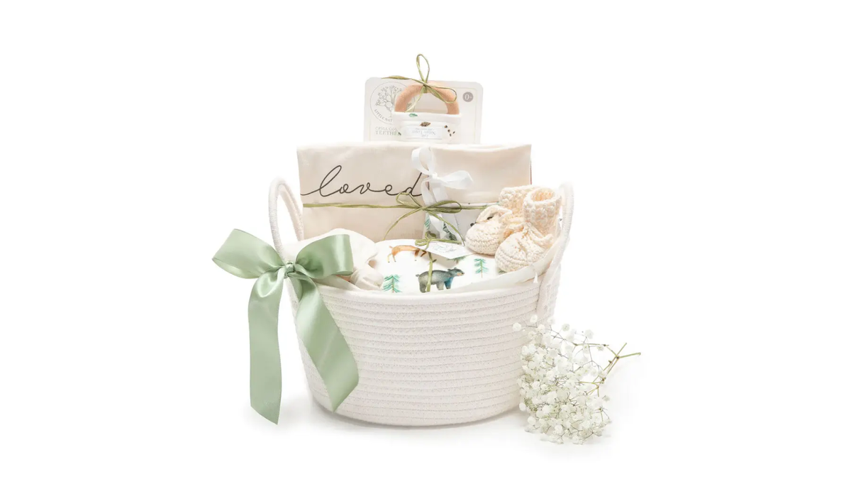 Baby shower gift basket filled with newborn essentials and organic clothing— Stork Baby Gift Baskets