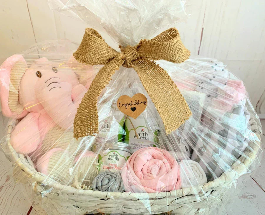 Personalized newborn baby girl gift basket wrapped and ready to give