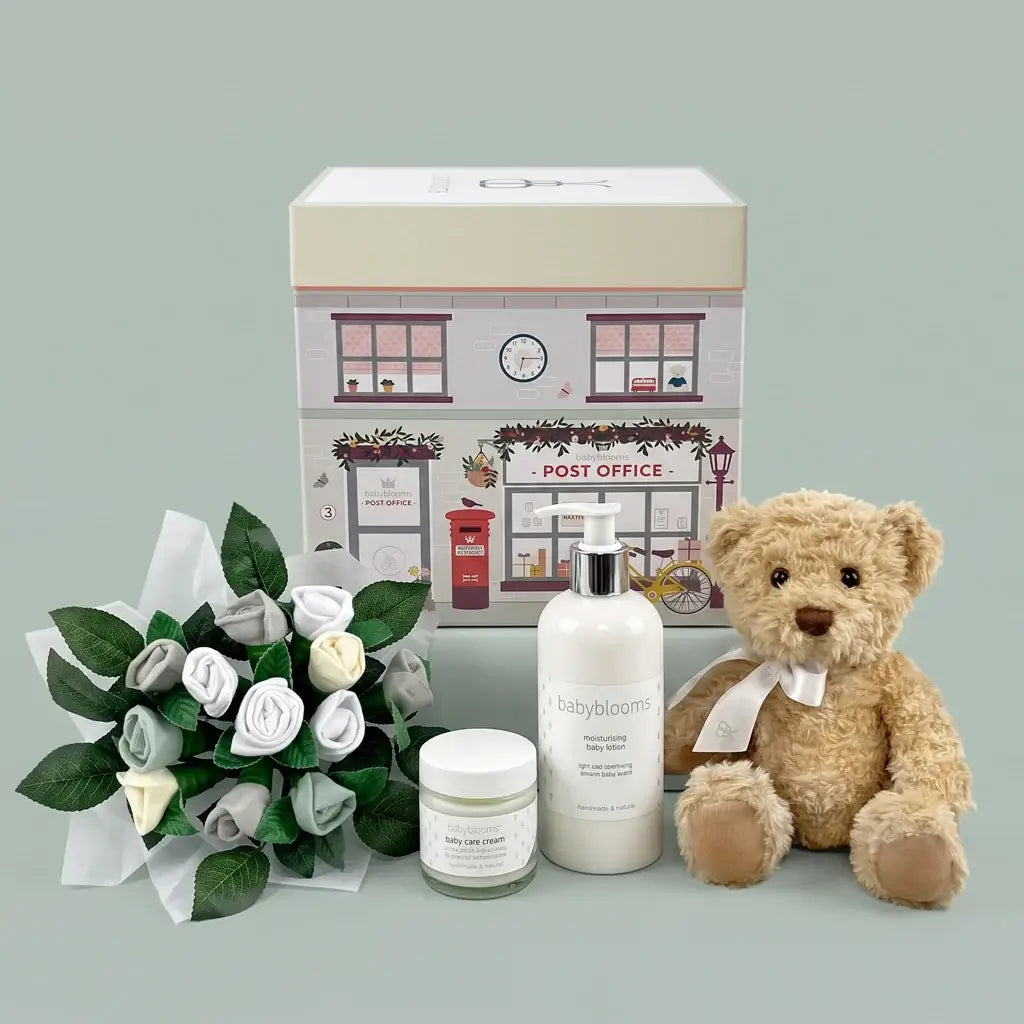 Luxury newborn gift box for baby with plush bear, bouquet, baby lotion, and cream — beautifully packaged and ready to give
