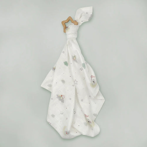 White muslin cloth with star and cloud print tied to a natural wooden star-shaped teether, light gray background.