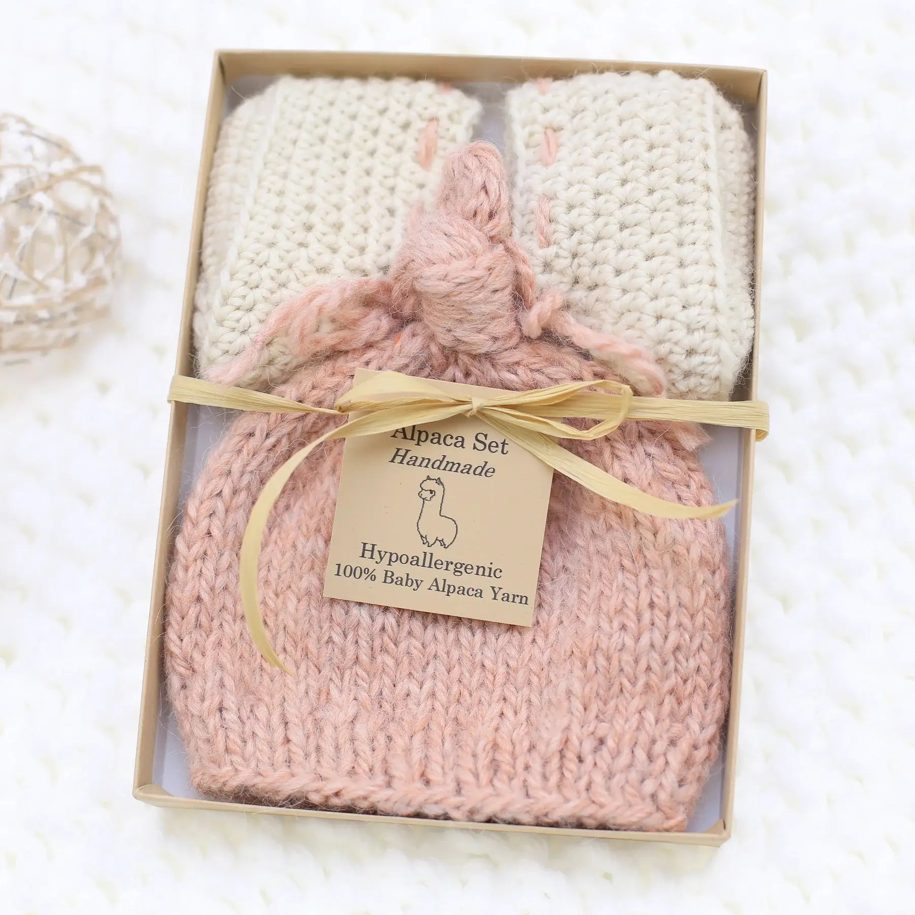 Handmade blush pink baby alpaca knotted cap and bootie set, gift-boxed, newborn size, soft natural fiber