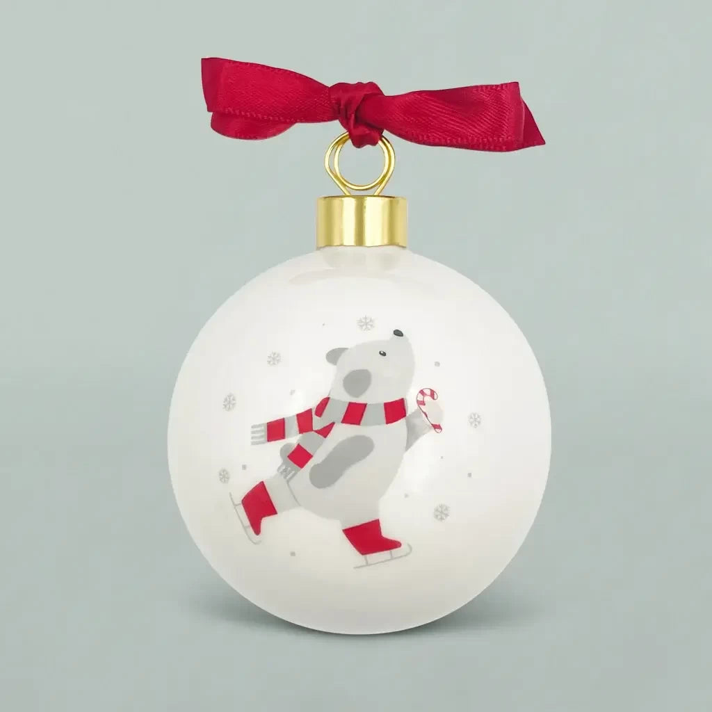 Baby's First Christmas fine bone china teddy bear ornament with skating design and red ribbon