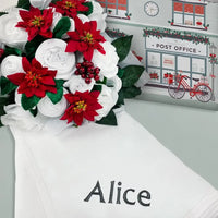 Christmas Rose luxury baby clothes bouquet with poinsettias and holly, with a personalized swaddle blanket