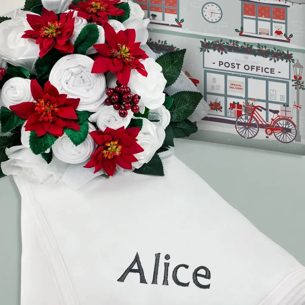 Christmas Rose luxury baby clothes bouquet with poinsettias and holly, with a personalized swaddle blanket