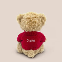 Back of red teddy bear sweater embroidered with 2026 for baby's first Christmas