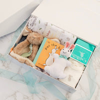 The Little Bunny Welcome Set displayed in a collapsible magnetic gift box, ready to give