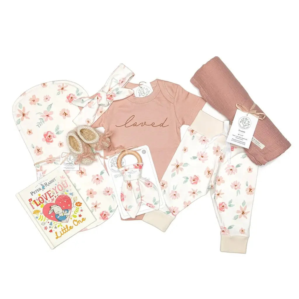 9-piece organic baby girl layette set with Peter Rabbit board book and mauve muslin swaddle