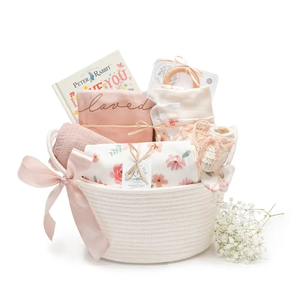 Mauve Meadow organic baby girl gift basket with book and swaddle — 9-piece layette set