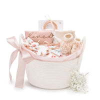 Mauve Meadow organic baby girl gift basket with layette set in white rope basket