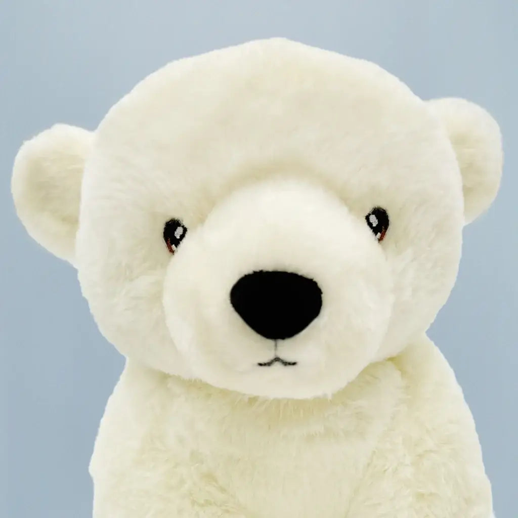 Close-up of Perry Polar Bear white plush soft toy made from recycled materials