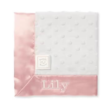 Pink baby lovey blanket personalized with a baby’s name embroidered on the blanket