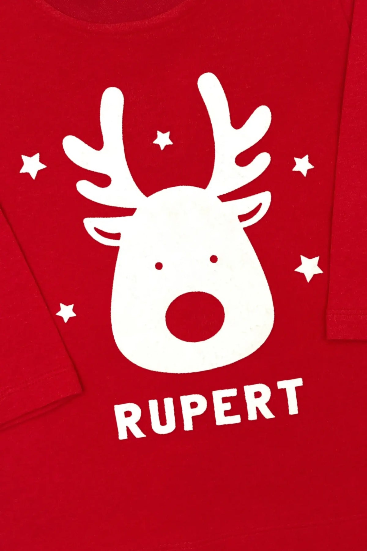 Close-up of reindeer design and personalized name on red Christmas t-shirt