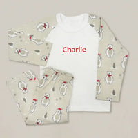 Baby Christmas pajamas with polar bears in red scarves and Santa hats