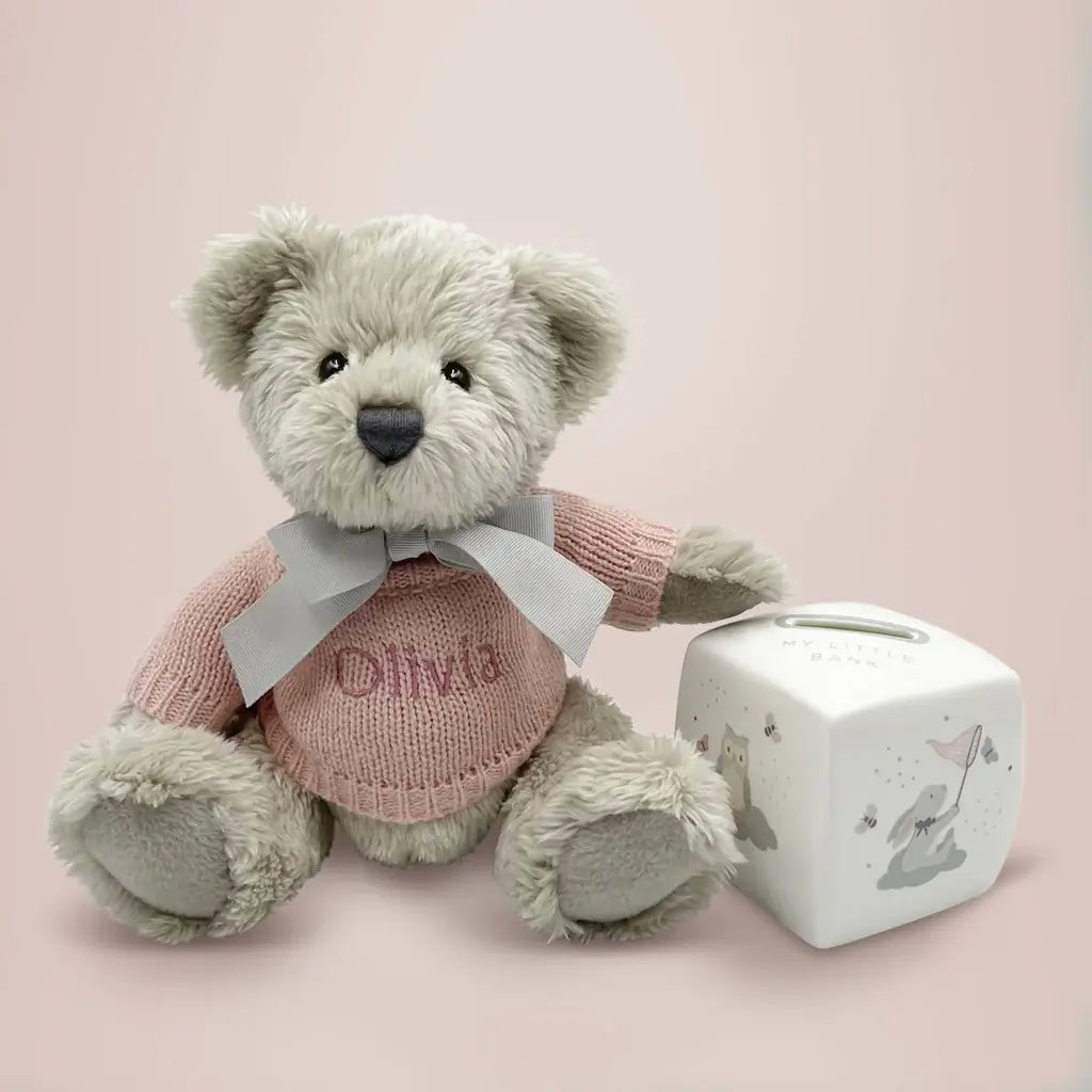 Personalized teddy bear in pink knitted jumper with bone china money box keepsake gift set for baby girls, presented in an illustrated gift box with satin ribbon