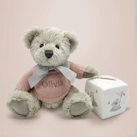 Personalized teddy bear in pink knitted jumper with bone china money box keepsake gift set for baby girls, presented in an illustrated gift box with satin ribbon