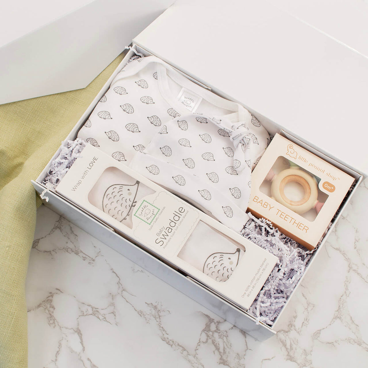 Hedgehog baby gift set with cotton pajama gown, hat, muslin swaddle and teether in a magnetic gift box