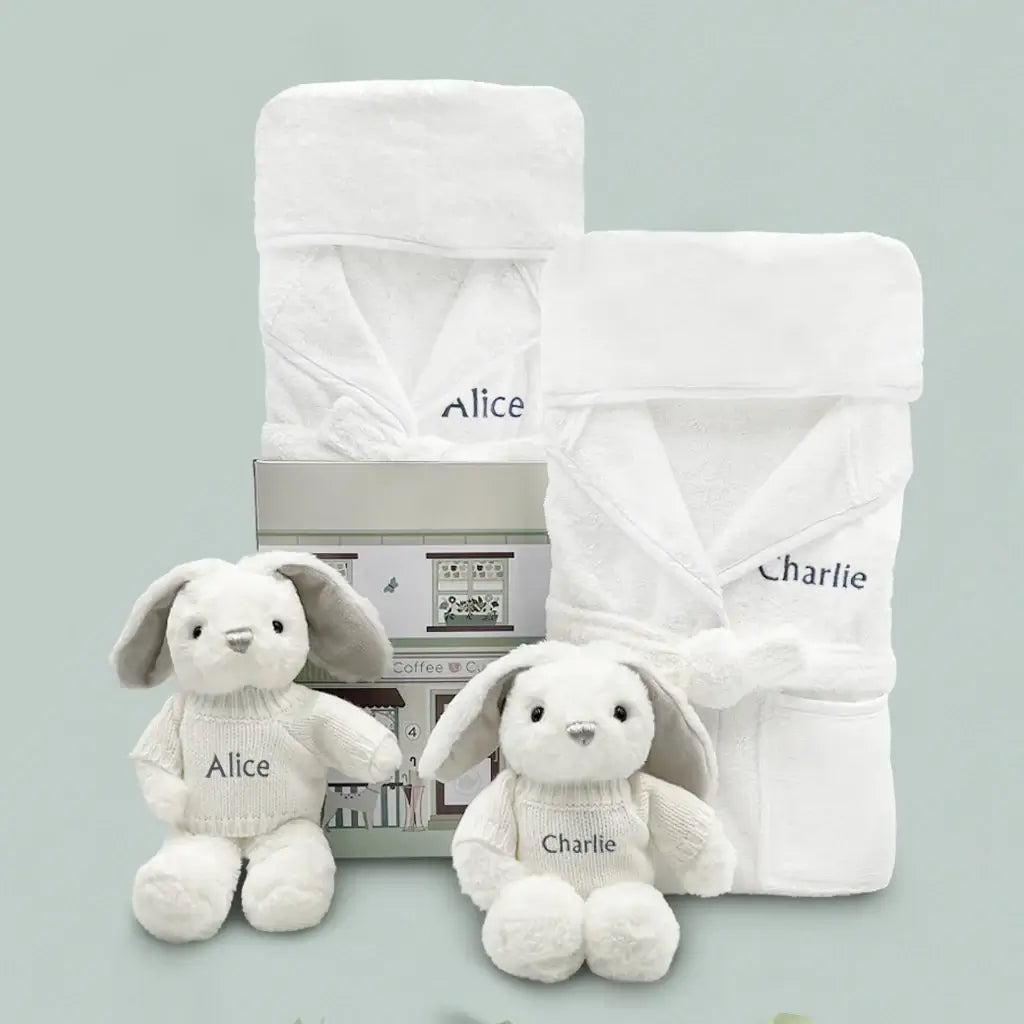 Personalized twin baby gift set with two embroidered plush bunny toys and two white hooded baby bathrobes
