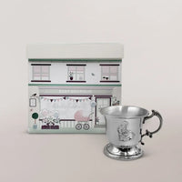 Handcrafted English pewter baby cup in Victorian pedestal style with ornate handle and detailed bunny motif, presented in an illustrated gift box